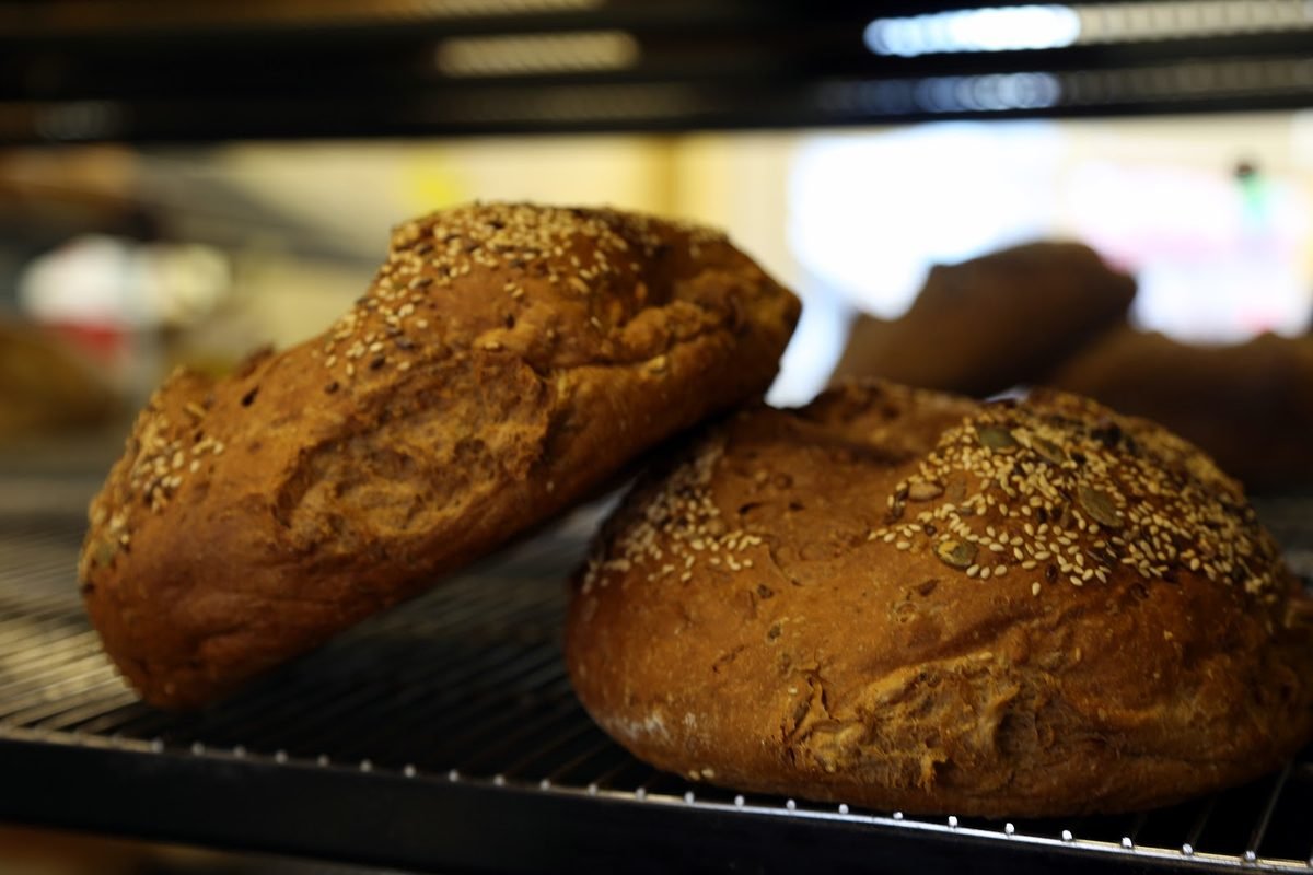 Seeded brown loaves cooling on the rack at Courtney's Bakery