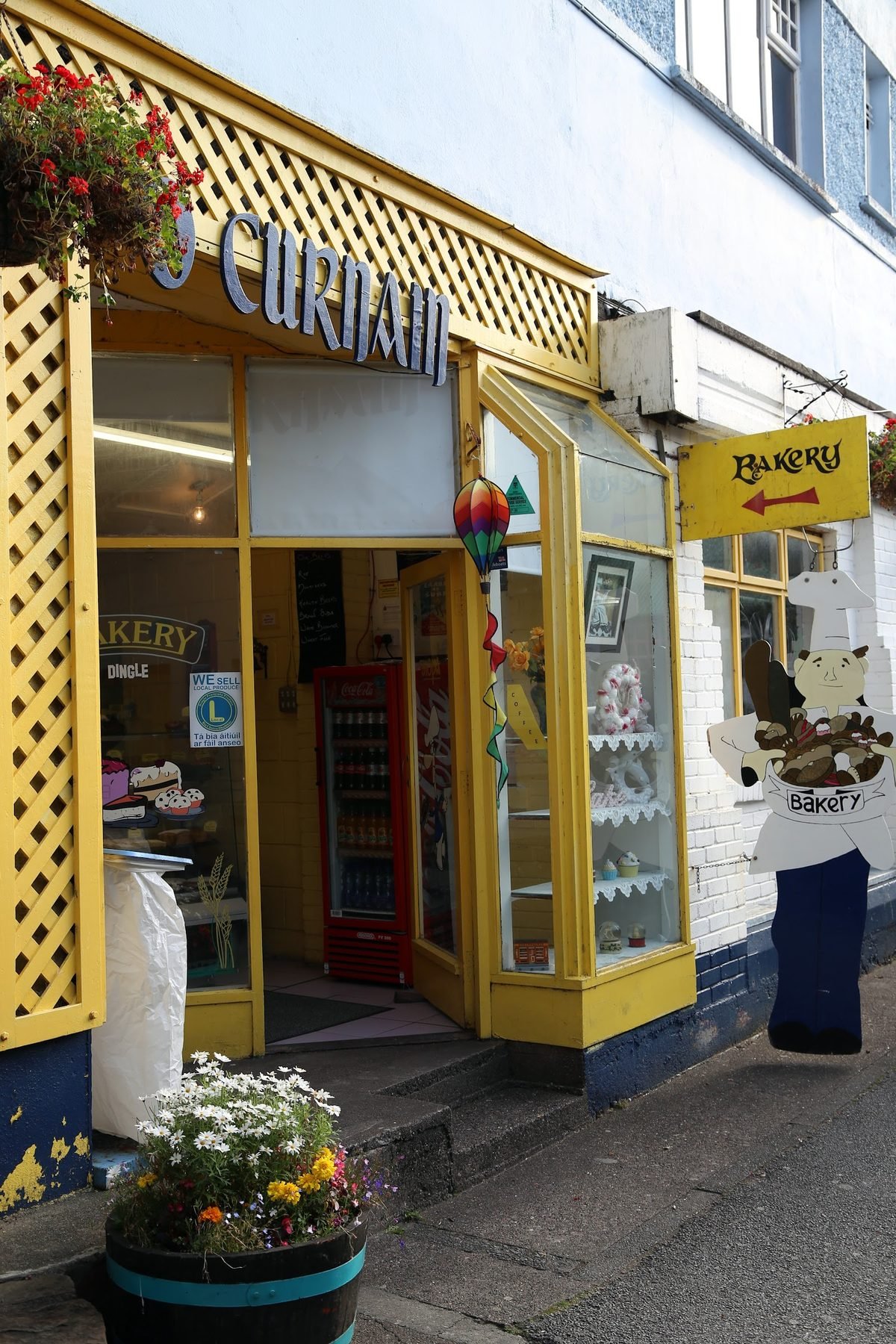 The bright yellow shopfront of Courtney's Bakery on Green Street, Dingle